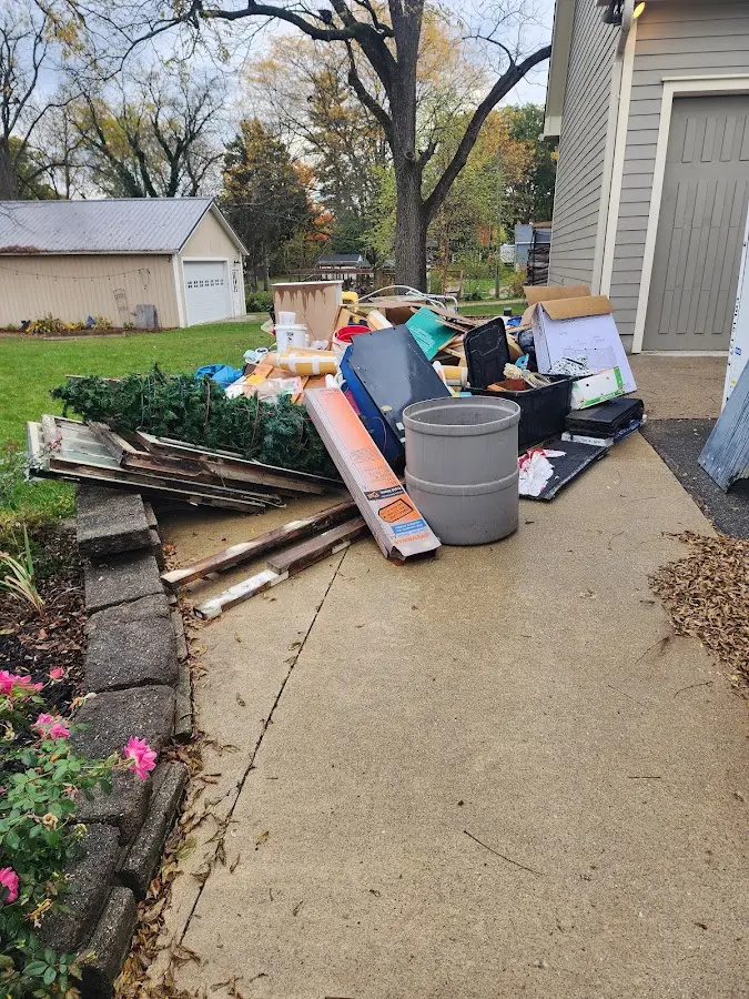 Dumpster being loaded with debris for Commercial Dumpster Rental in Johnson